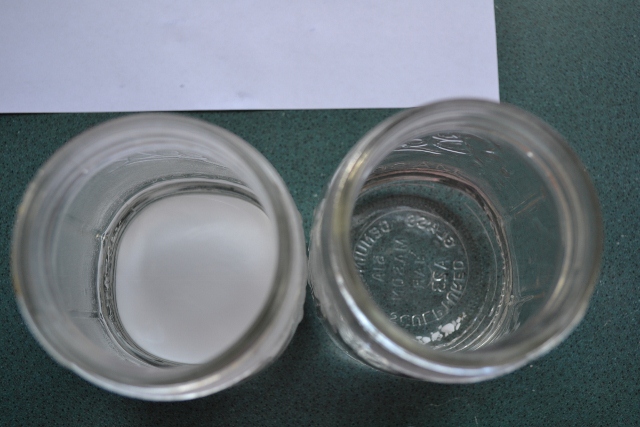 Overhead view of two jars and residue