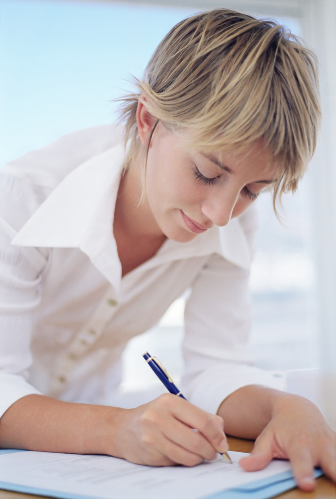 Woman recording expenses